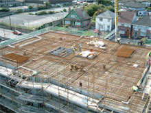 Continue top mat reinforcement installation and cast bottom-third of walls.